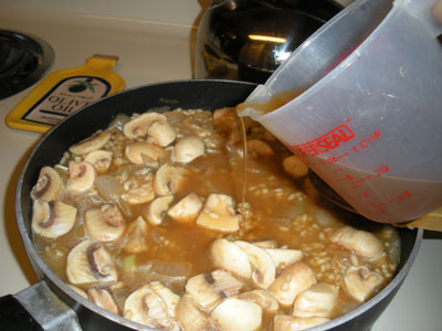 Gradually add the broth to the risotto